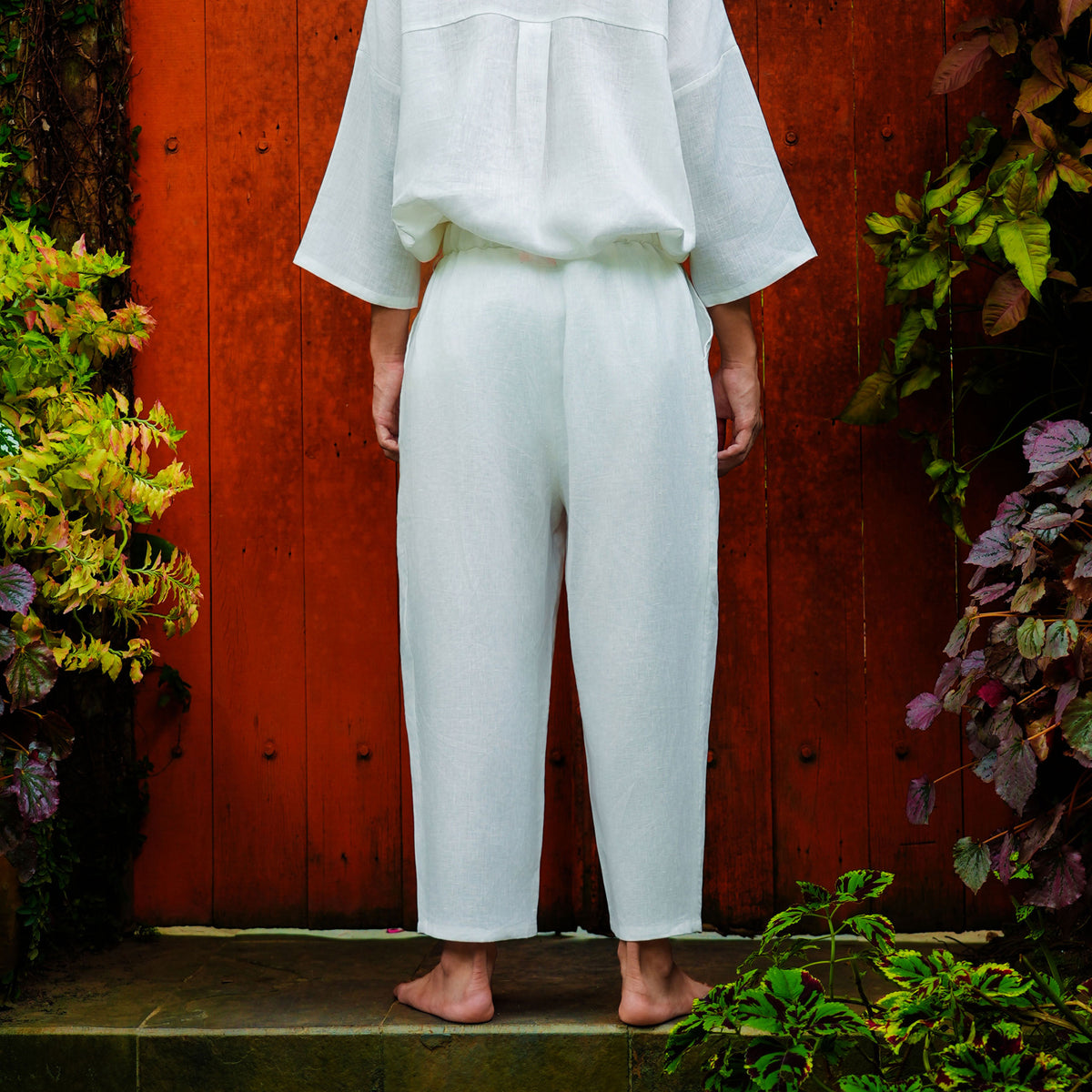 Syomsz Bujang white linen trousers, side view