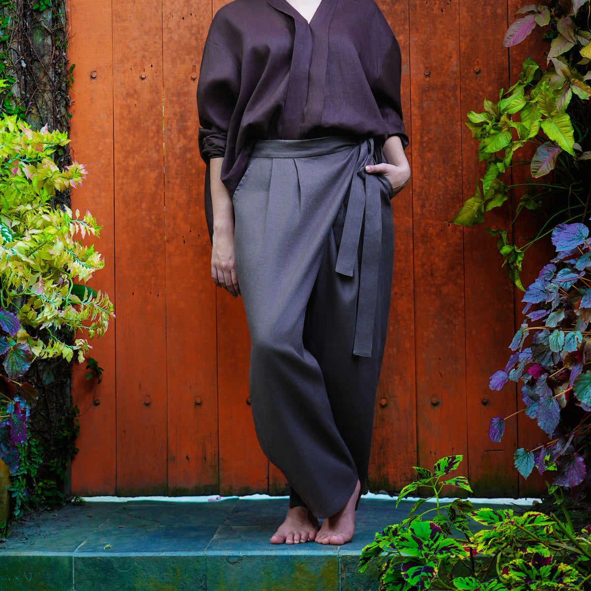 Syomsz Bujang sarong-style linen trousers in chocolate, front view